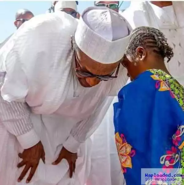 President Buhari and little girl share a tender moment